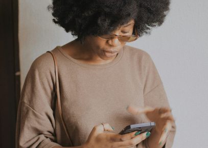Woman scheduling laundry service on smartphone